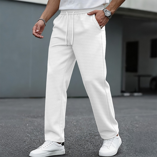 🔥 50% OFF HOJE! 👖 Calça Casual Masculina de Tricô Waffle com Cordão – Confortável, Respirável e Perfeita Para o Dia a Dia ✨